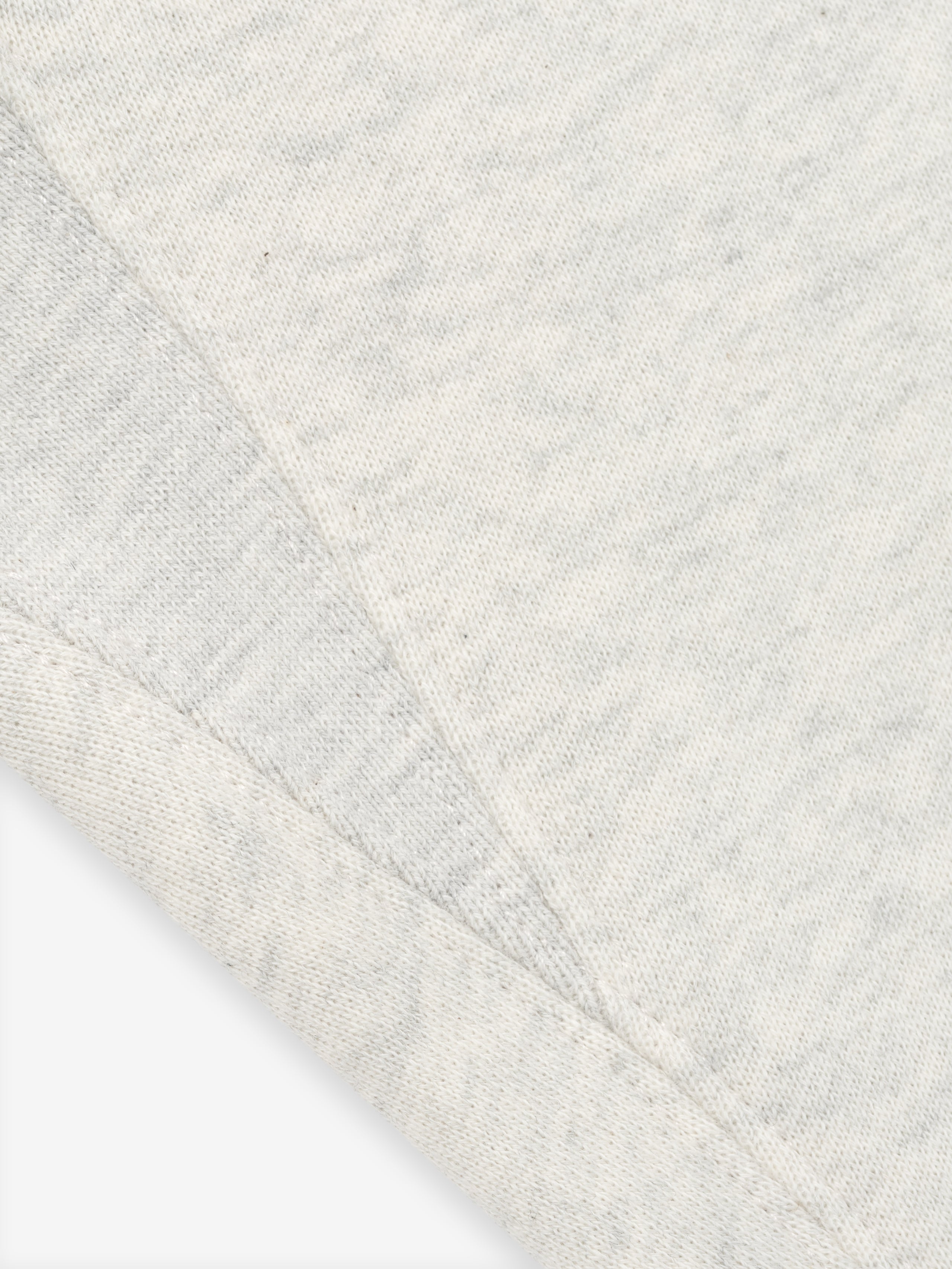 close-up of light grey Kids Classic Sweatpant fabric showing textured core fleece material and stitching details