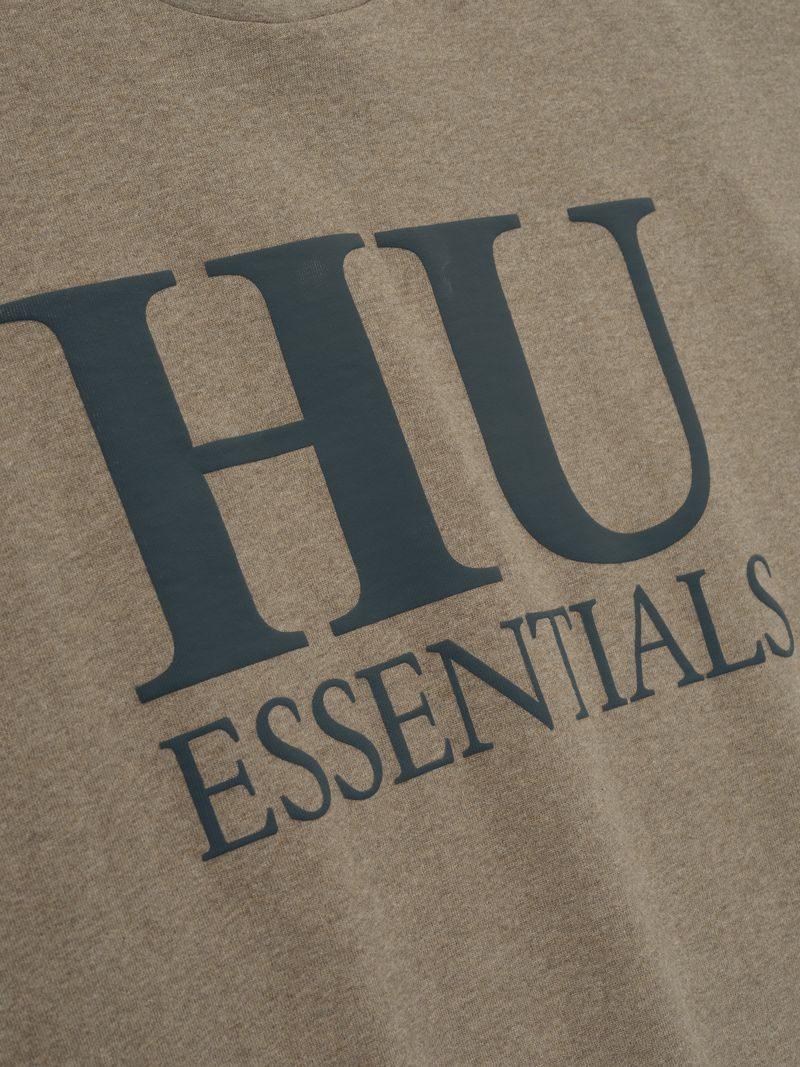 Close-up of brown Howard University 90s Tee featuring large dark "HU ESSENTIALS" text on front DDaMfPzA gallery 0