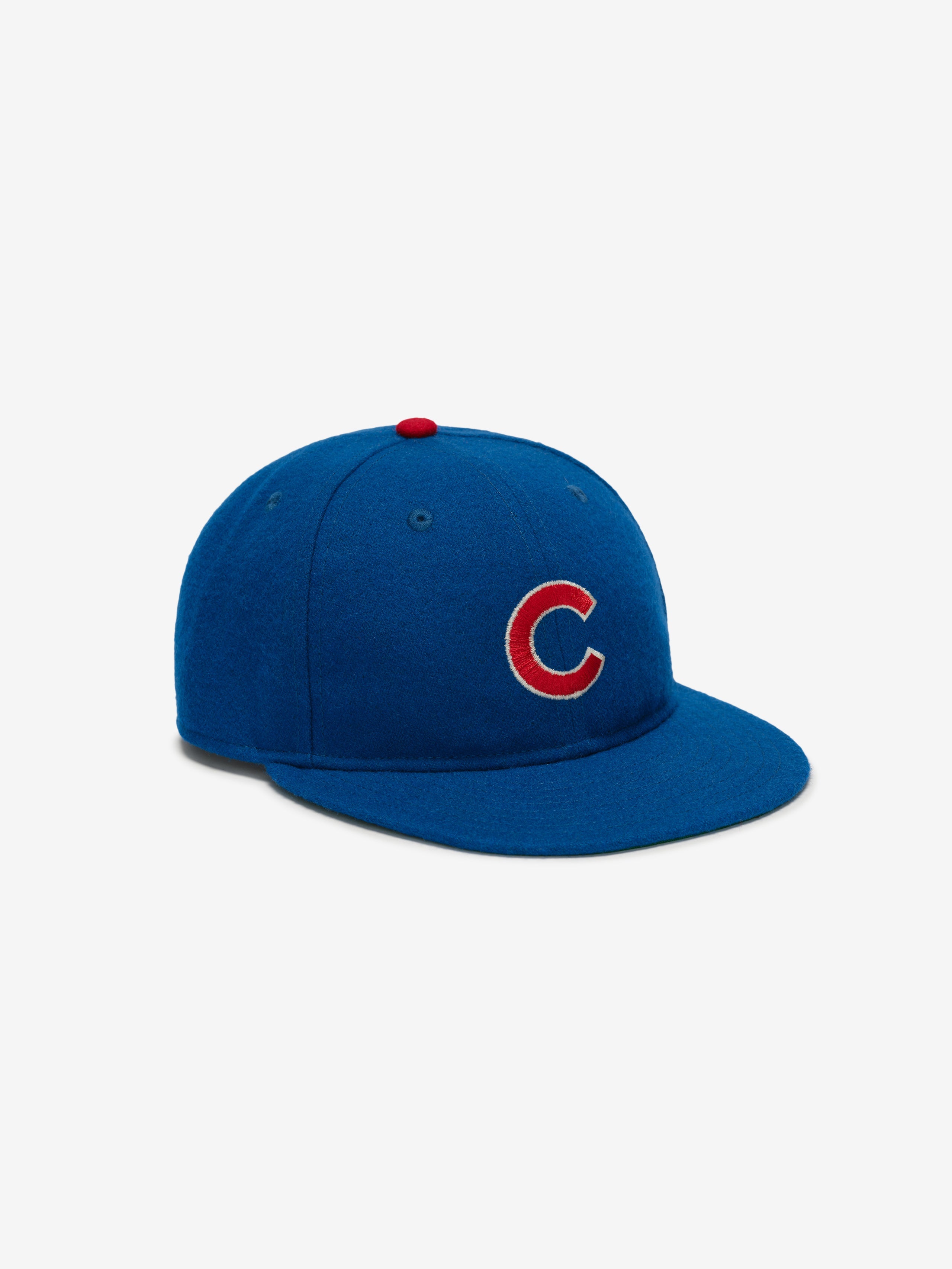 Three-quarter left view of royal blue Chicago Cubs Wool Retro Crown 59FIFTY fitted cap with red embroidered C and button top