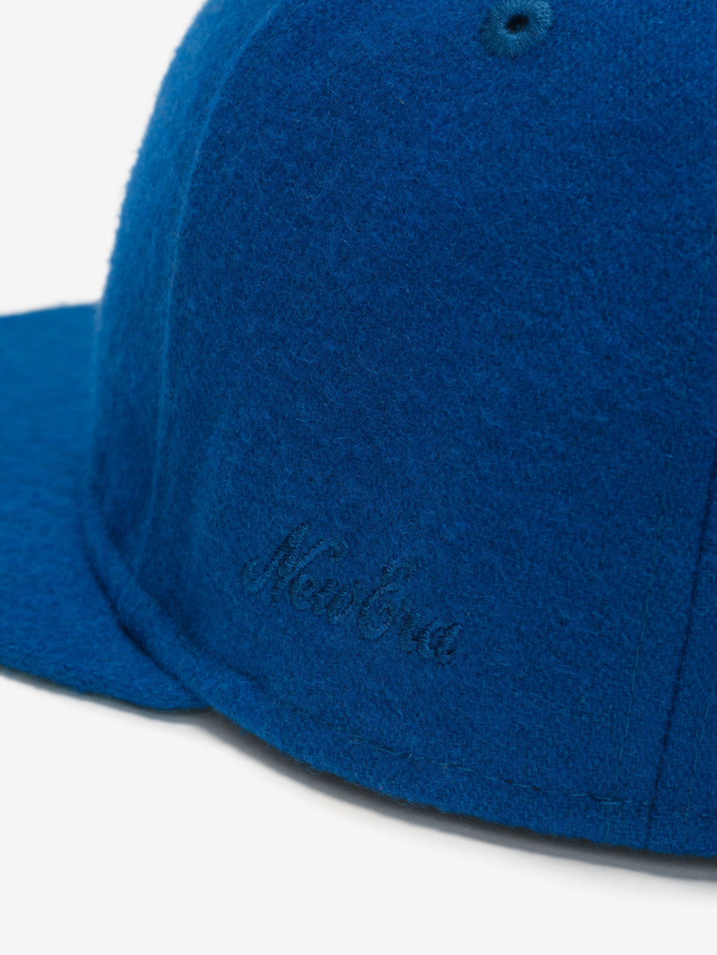 Close-up of blue Chicago Cubs Wool Retro Crown 59FIFTY fitted cap showing subtle tonal embroidered New Era signature detail