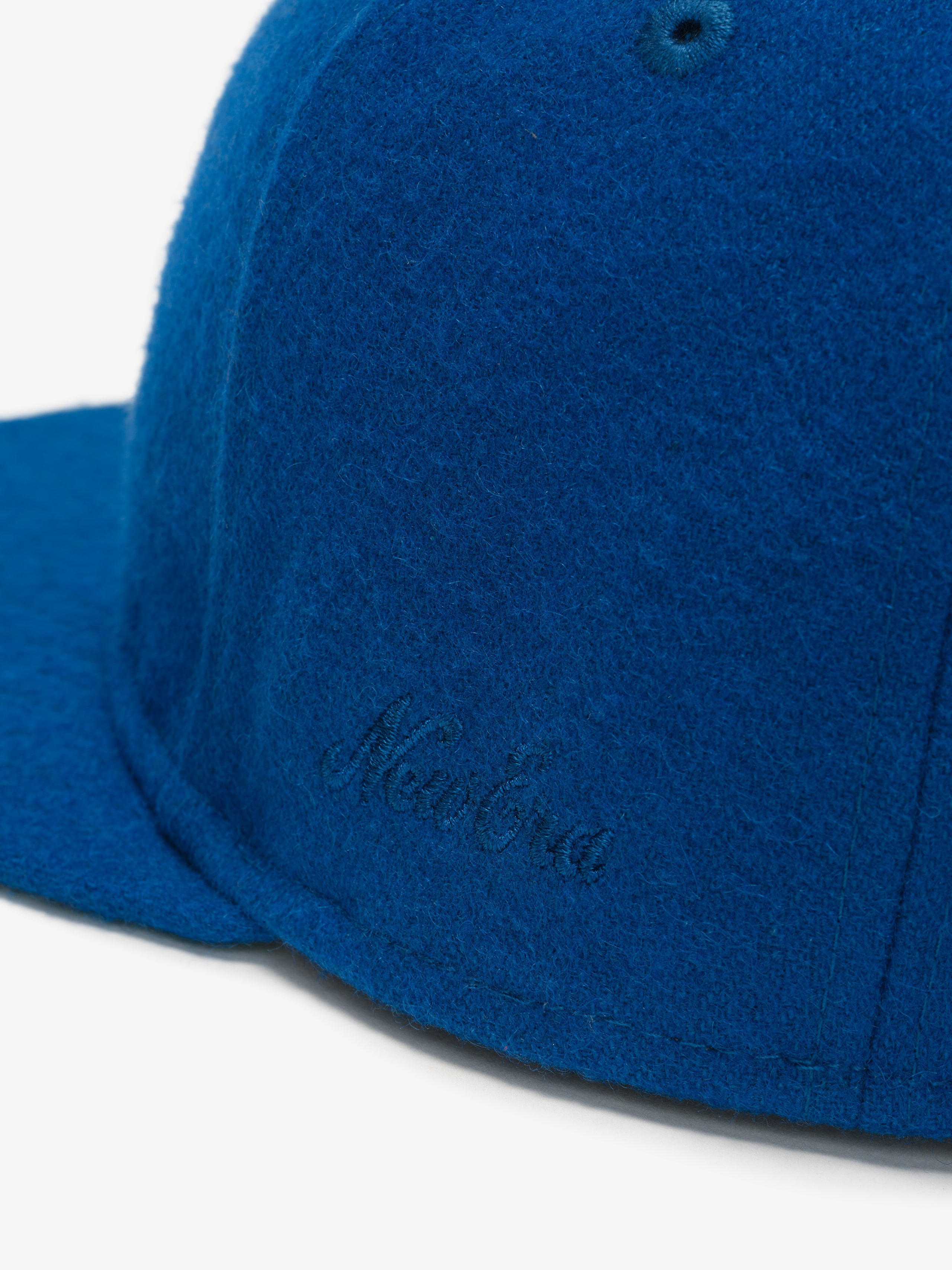 Close-up of blue Chicago Cubs Wool Retro Crown 59FIFTY fitted cap showing subtle tonal embroidered New Era signature detail