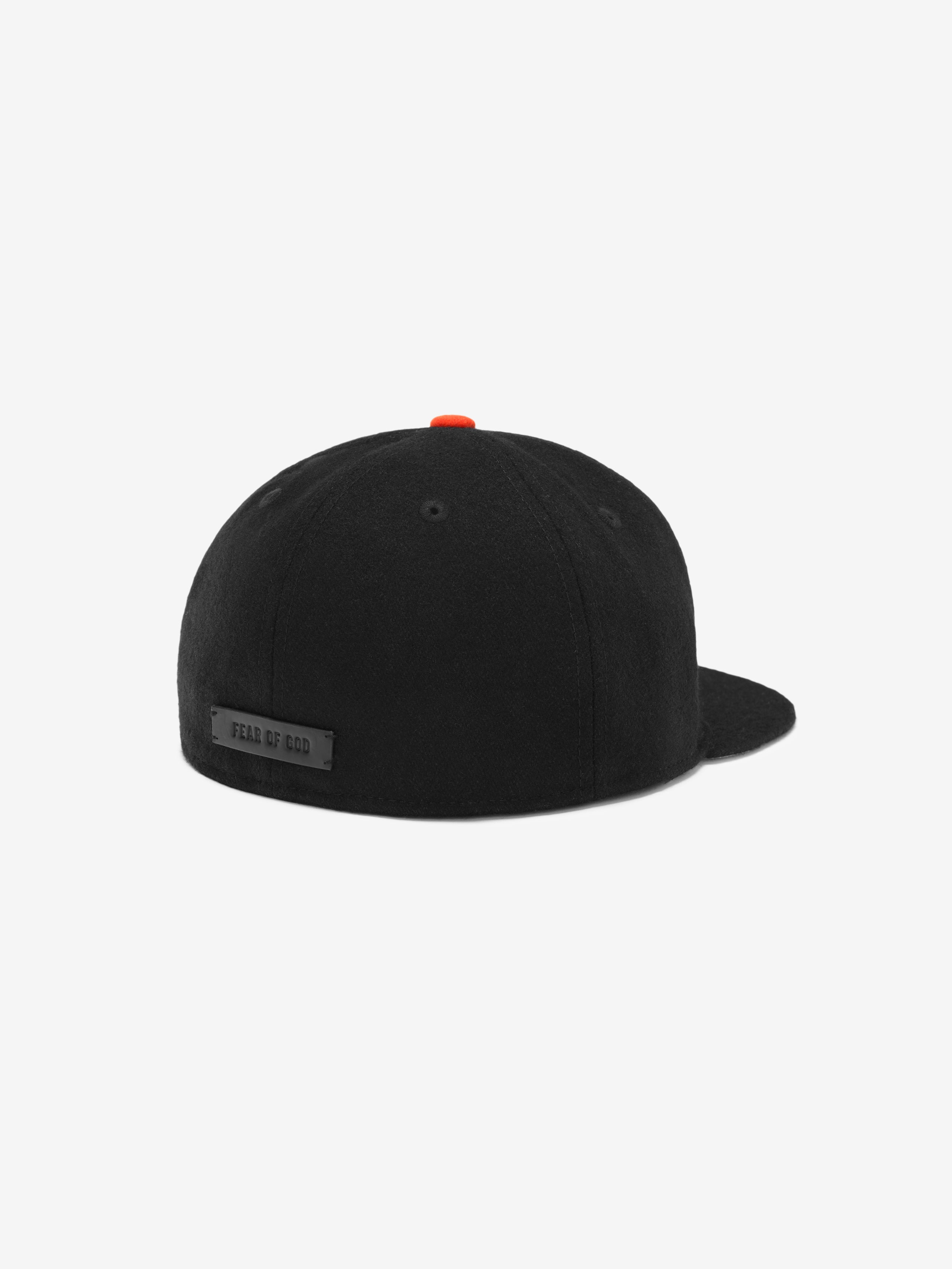 Side rear view of black San Francisco Wool Retro Crown 59FIFTY fitted cap with orange button and Fear of God label, gallery image 0