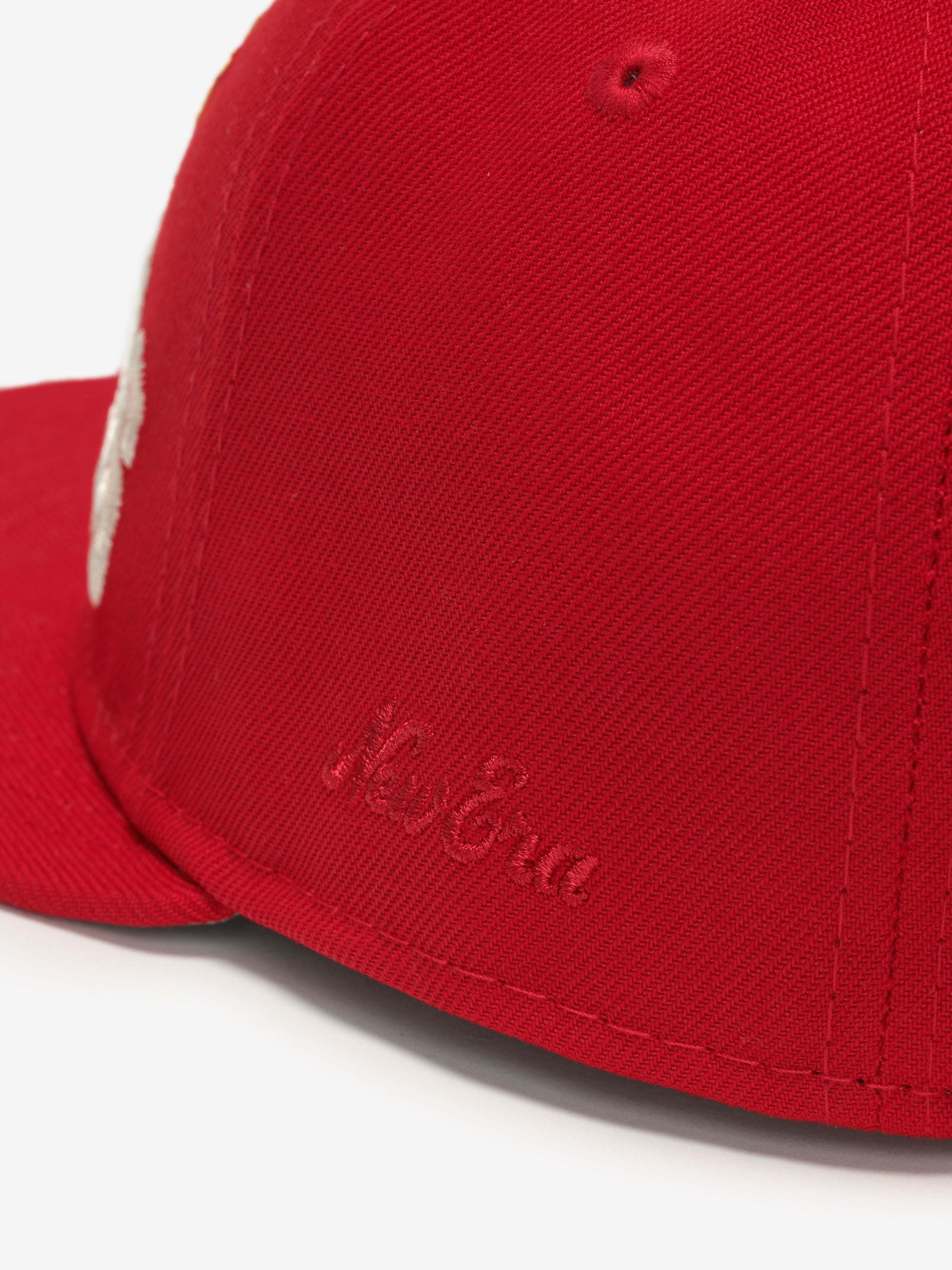 Close-up angled view of red Chiefs 9Fifty RC Snapback showing subtle embroidered New Era logo on side panel, gallery image 0