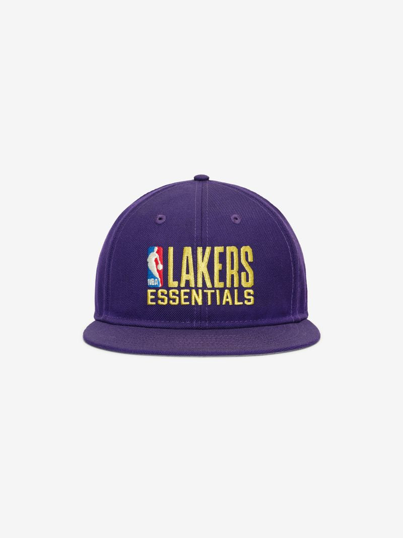 Front view of purple Lakers 9Fifty RC Snapback with flat brim and yellow embroidered Lakers Essentials logo