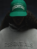Front view of green Eagles 9Fifty RC Snapback with white Philadelphia Essentials embroidery, worn by shadowed model, IMAGE34v2.jpg