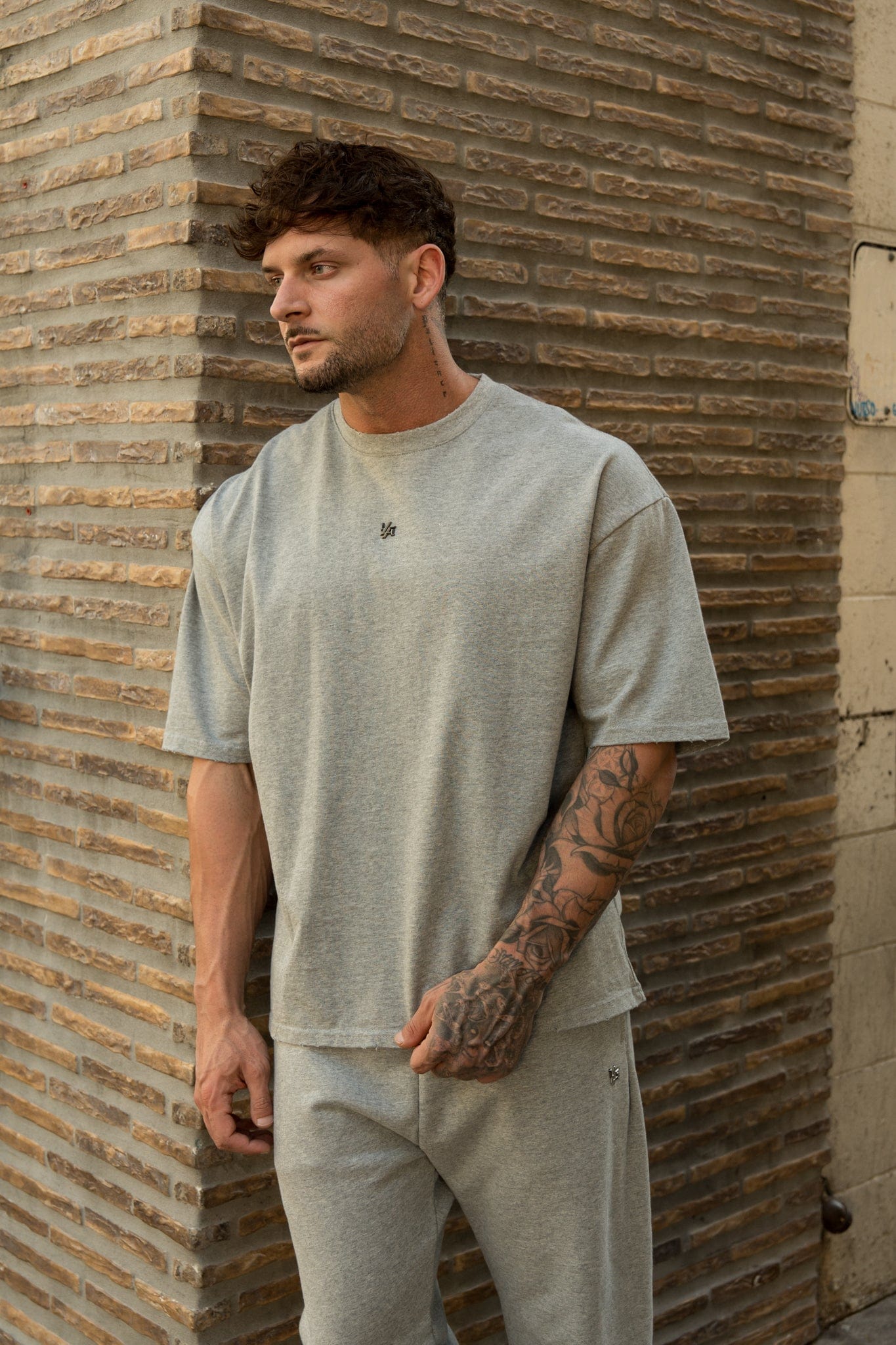 4153 - Elevated Essentials - Relaxed Tee - Oversized heavyweight cotton tee with drop shoulders, natural drape, and subtle 'Elevated' detailing in colour Heather Grey.