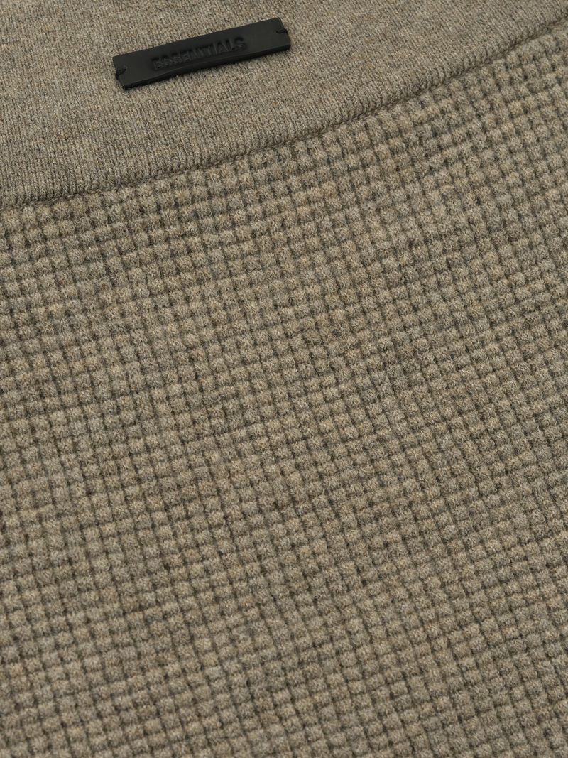 close-up of taupe waffle knit fabric with textured grid pattern and elastic waistband detail on women's boy short