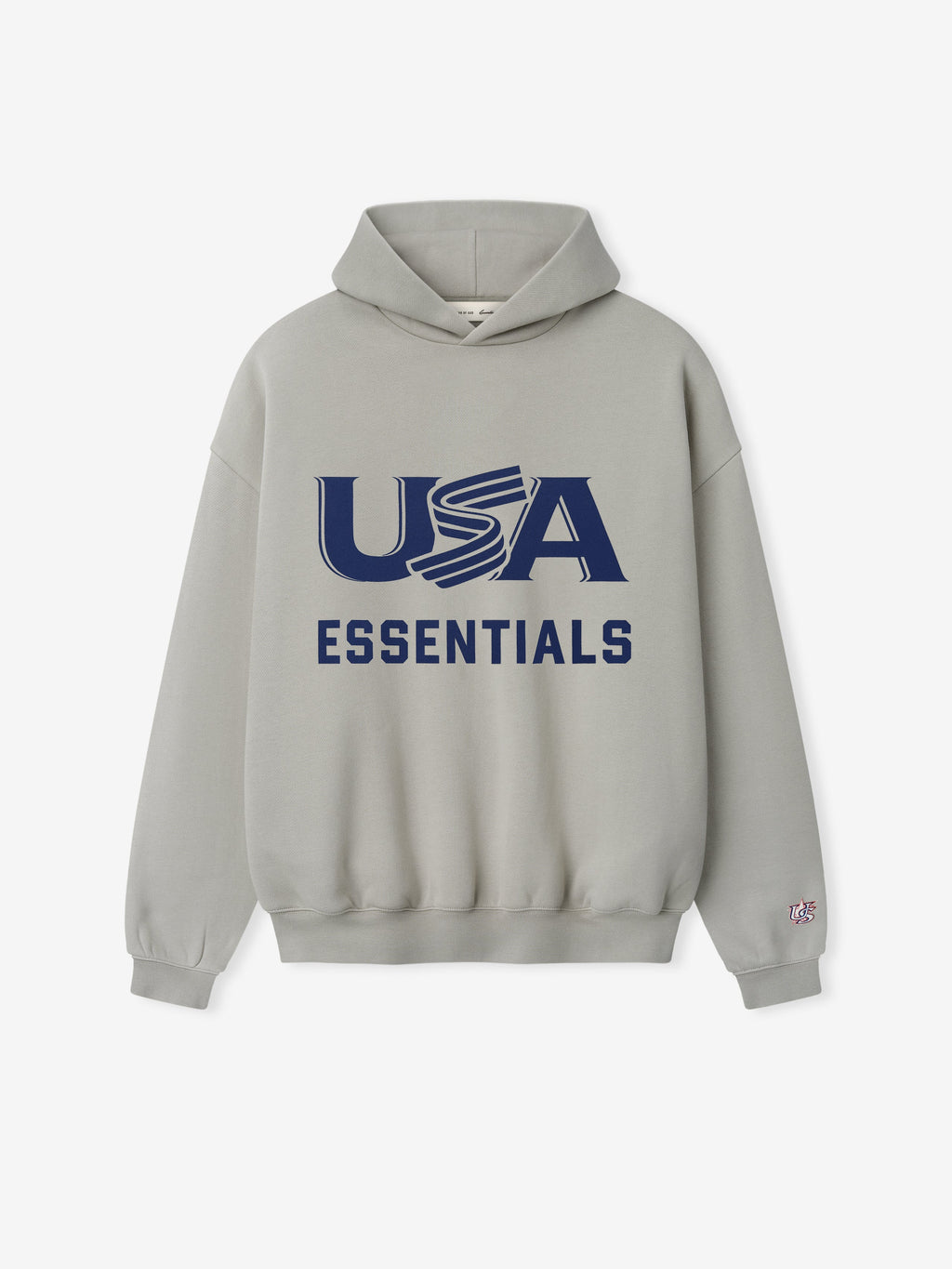 Light gray hoodie with large navy "USA" and bold "ESSENTIALS" text printed on front center and small sleeve patch