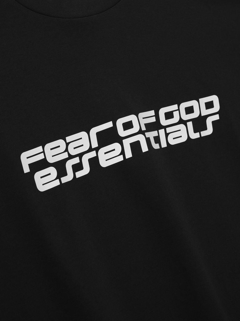 Black Ponte 90s Long Sleeve Tee close-up showing tilted white Fear of God Essentials logo, gallery image SCLAISdg.jpg