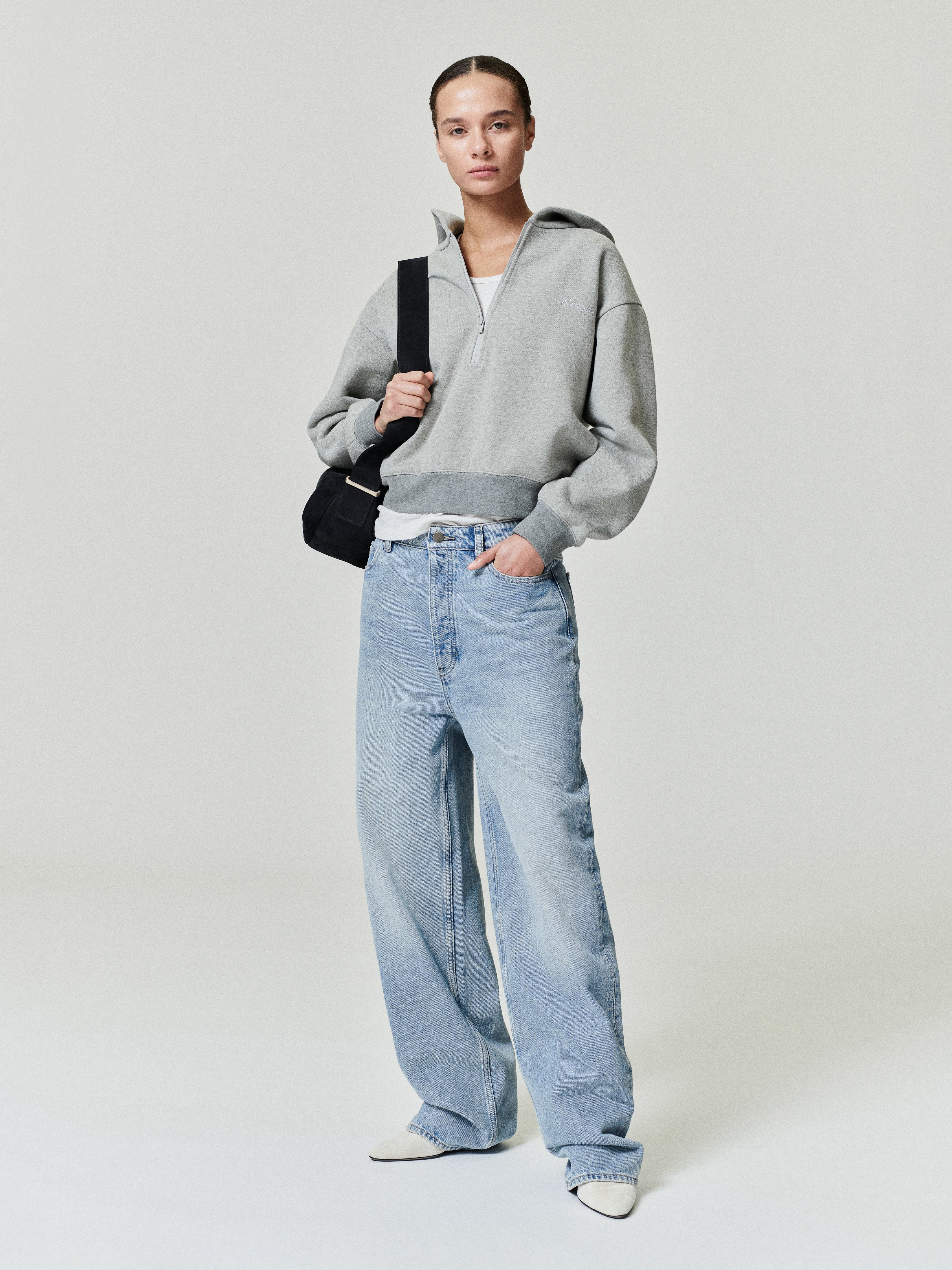 woman wearing vintage wash 100% cotton denim jeans with relaxed straight leg and low rise fit