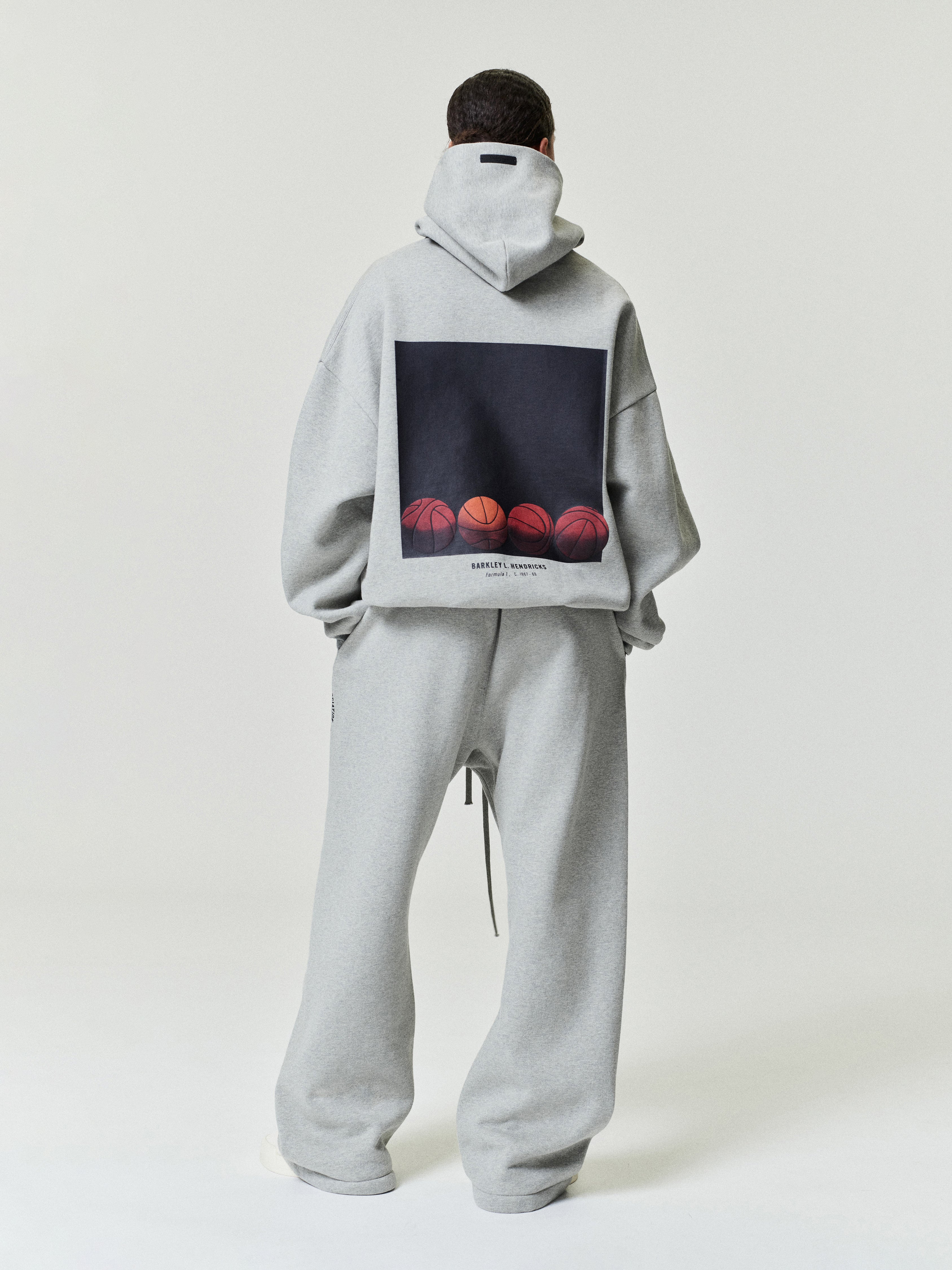 light grey hoodie with graphic of five basketballs in a row and Barkley Hendricks text on back