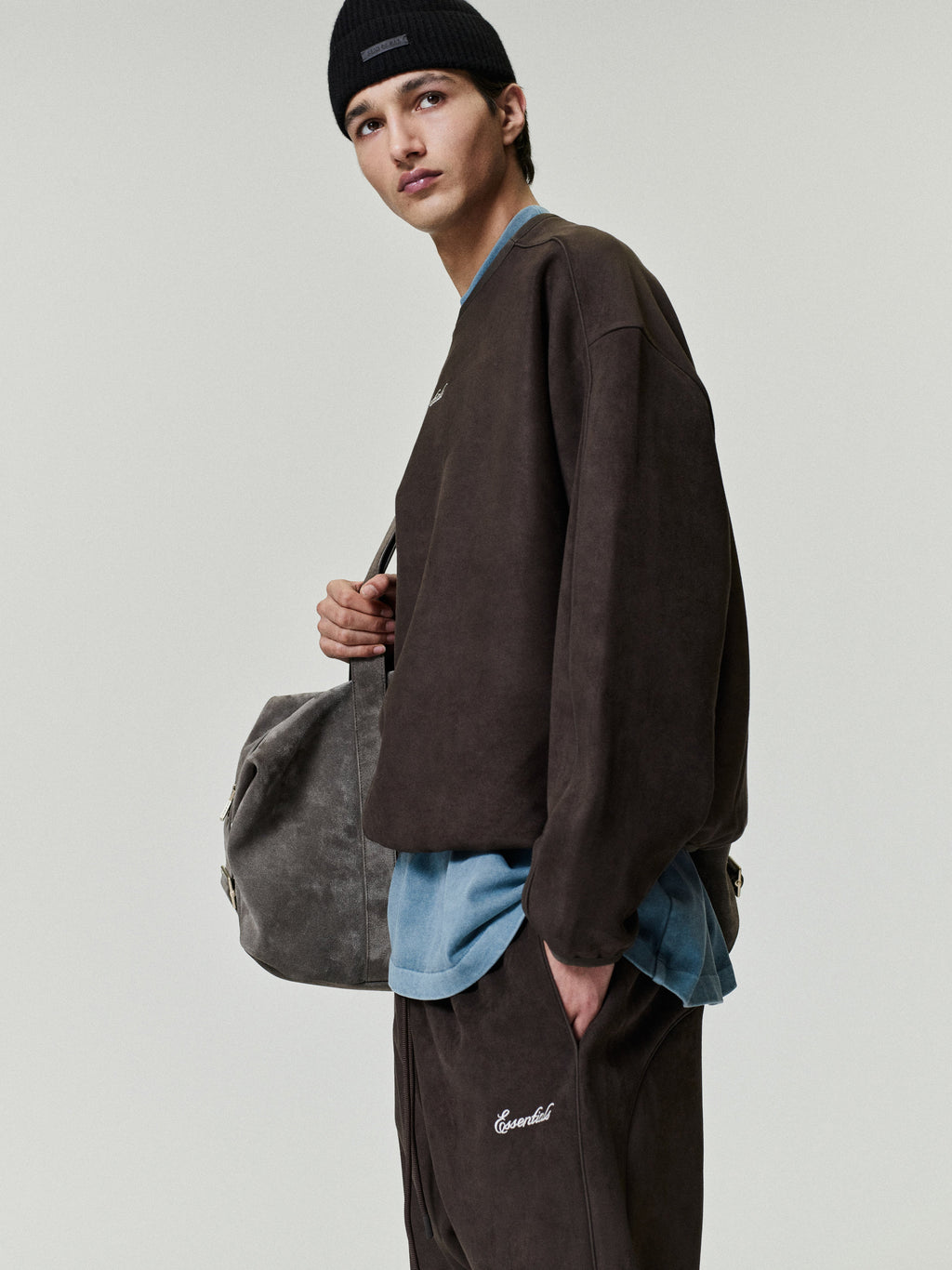 Person wearing a brown sweatshirt 