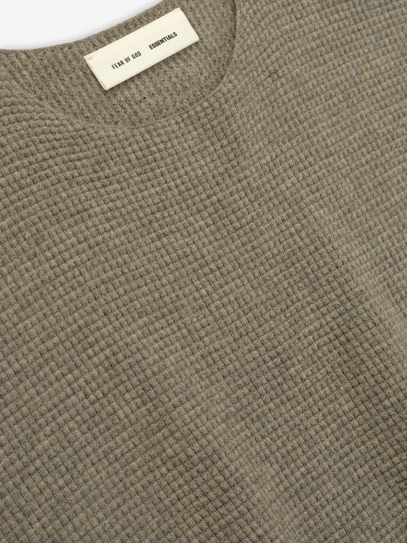 Close-up of taupe Waffle Crewneck 90s Sweater fabric texture and neckline with Fear of God Essentials label visible