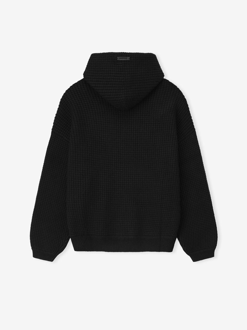 Back view of black Heavy Waffle 90s Hoodie highlighting textured knit fabric and relaxed fit with hood up on white background