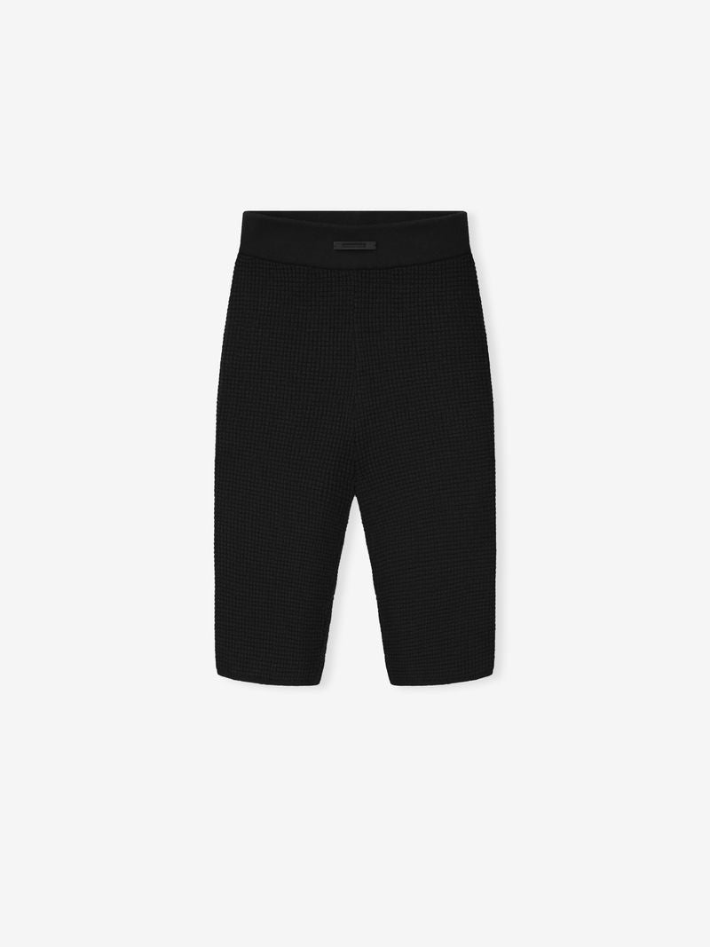 black waffle knit women's biker shorts with textured fabric and elastic waistband detail laid flat on white background