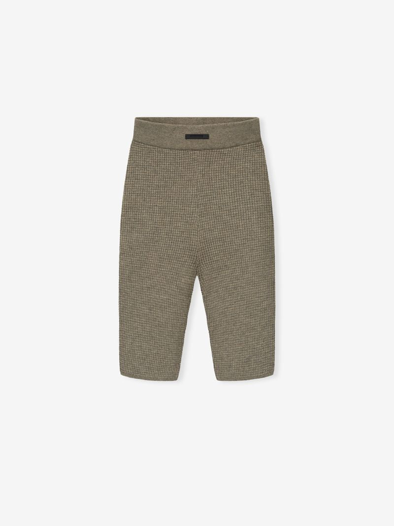 olive green women's waffle knit biker shorts with stretch fabric and high elastic waistband laid flat on white background