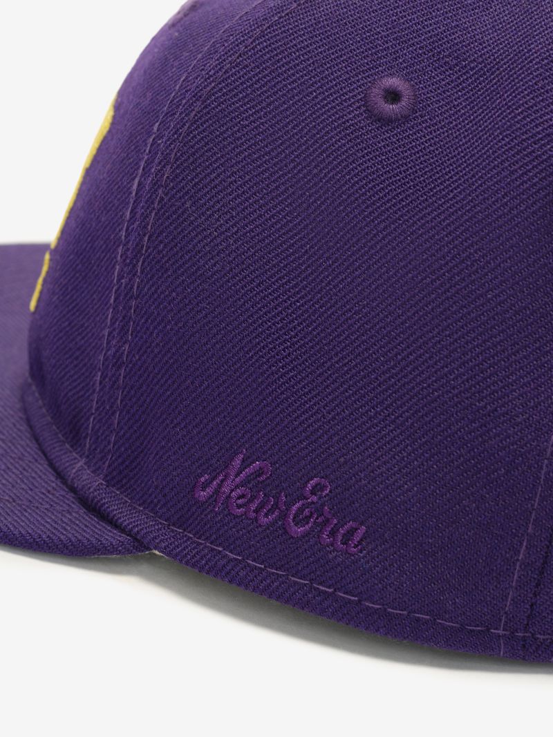 Close-up side view of purple Lakers 9Fifty RC Snapback featuring subtle purple New Era embroidered logo on panel