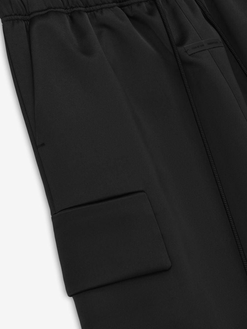 Close-up of black Bonded Satin Field Pant showing elastic waistband and angled cargo pocket, image trAG-ggw.jpg gallery 0