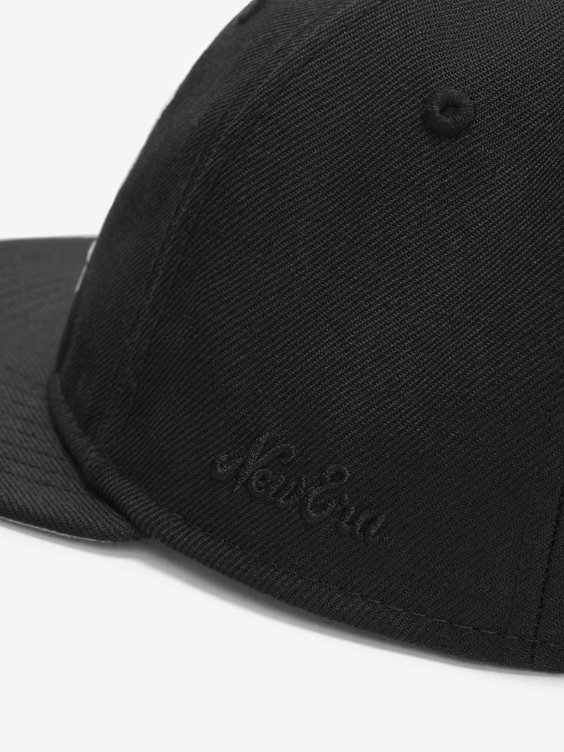 Close-up of black NBA 9Fifty RC Snapback showing tonal black New Era embroidery on front panel vBmhCxgA.jpg