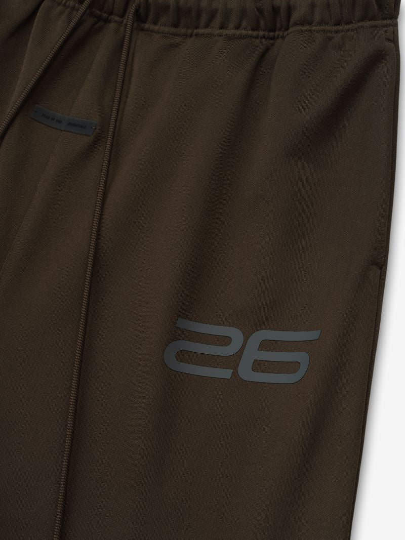 Close-up of dark brown Satin Fleece Lounge Sweatpant showing elastic waistband and modern "26" print detail, gallery position 0.