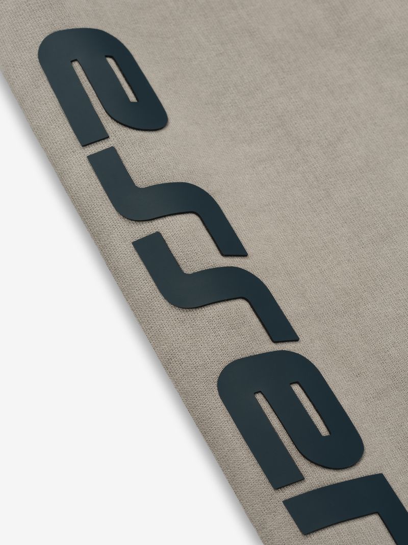 Close-up of black textured logo print on beige fabric of heavy fleece cropped relaxed sweatshirt wxRoE2AQ.jpg gallery 0