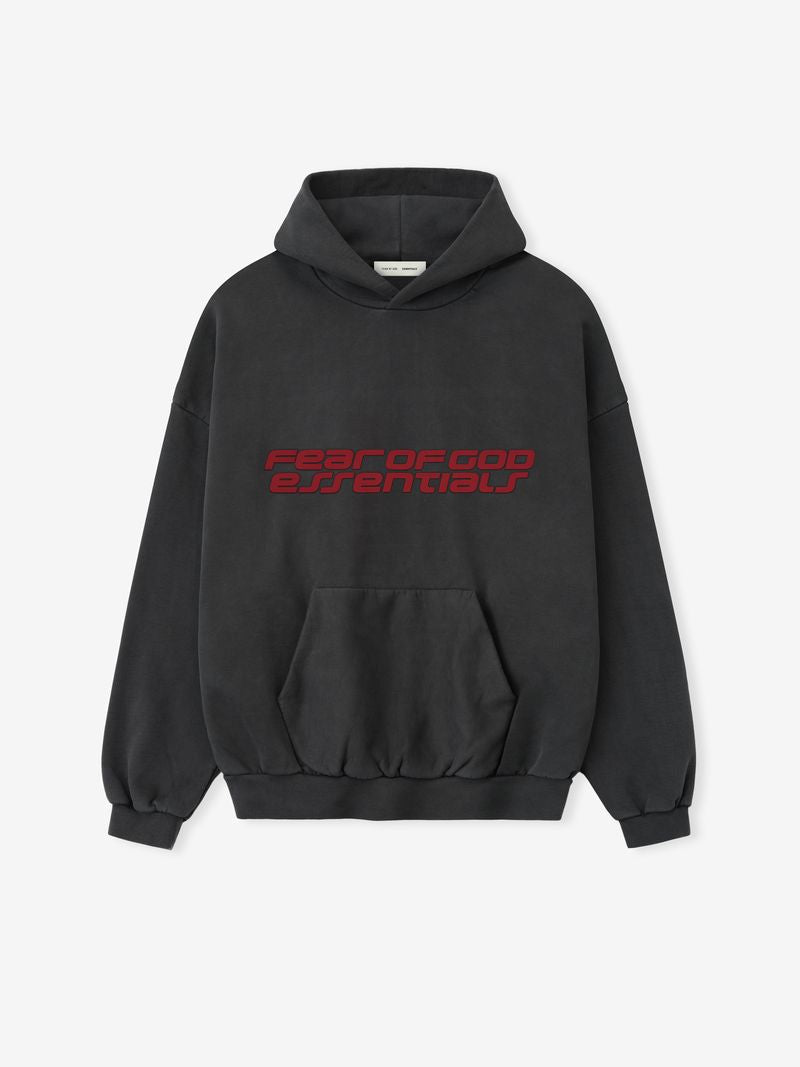 Black hoodie with red text reading 'fear of god essentials" on a white background