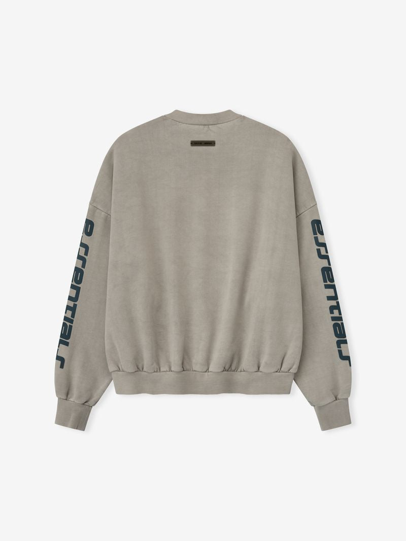 Back view of taupe heavy fleece cropped sweatshirt with navy essential text printed vertically on sleeves zdTNEkkA.jpg